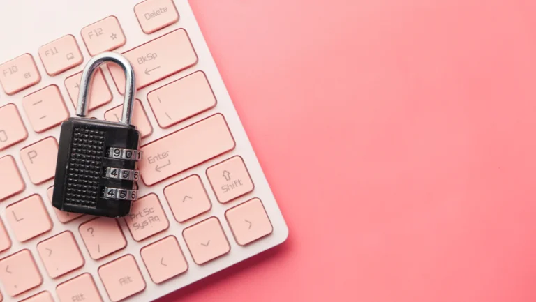 pink background and keyboard with lock