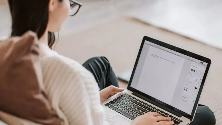 woman sitting down with computer