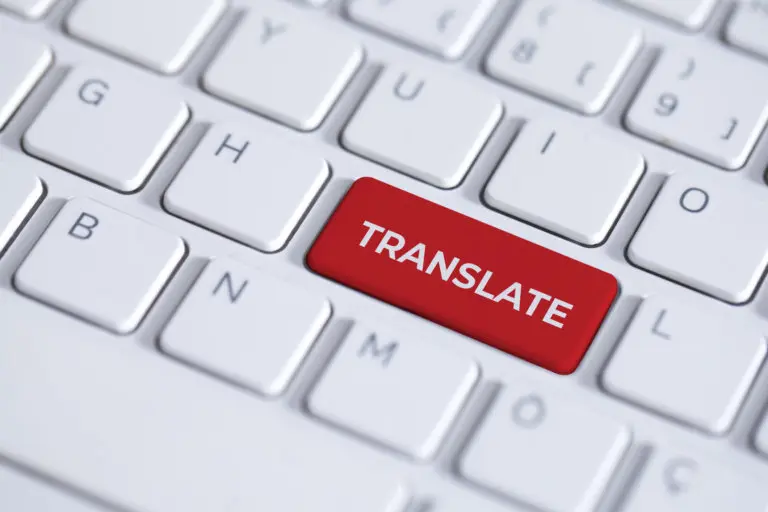 Red key with word translate on white laptop keyboard. The translate button has a text on keyboard