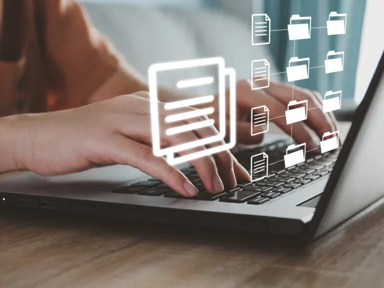 Photo of attorney's hands on keyboard, managing web files