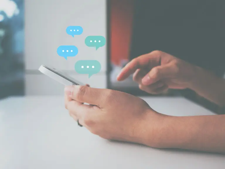 Set of female hands engaging on smart phone