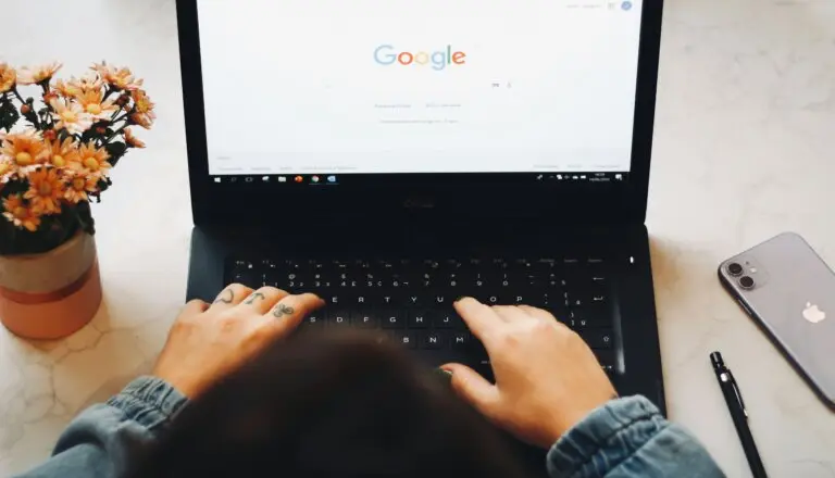 Photos of hands on keyboard and Google home page on screen of laptop